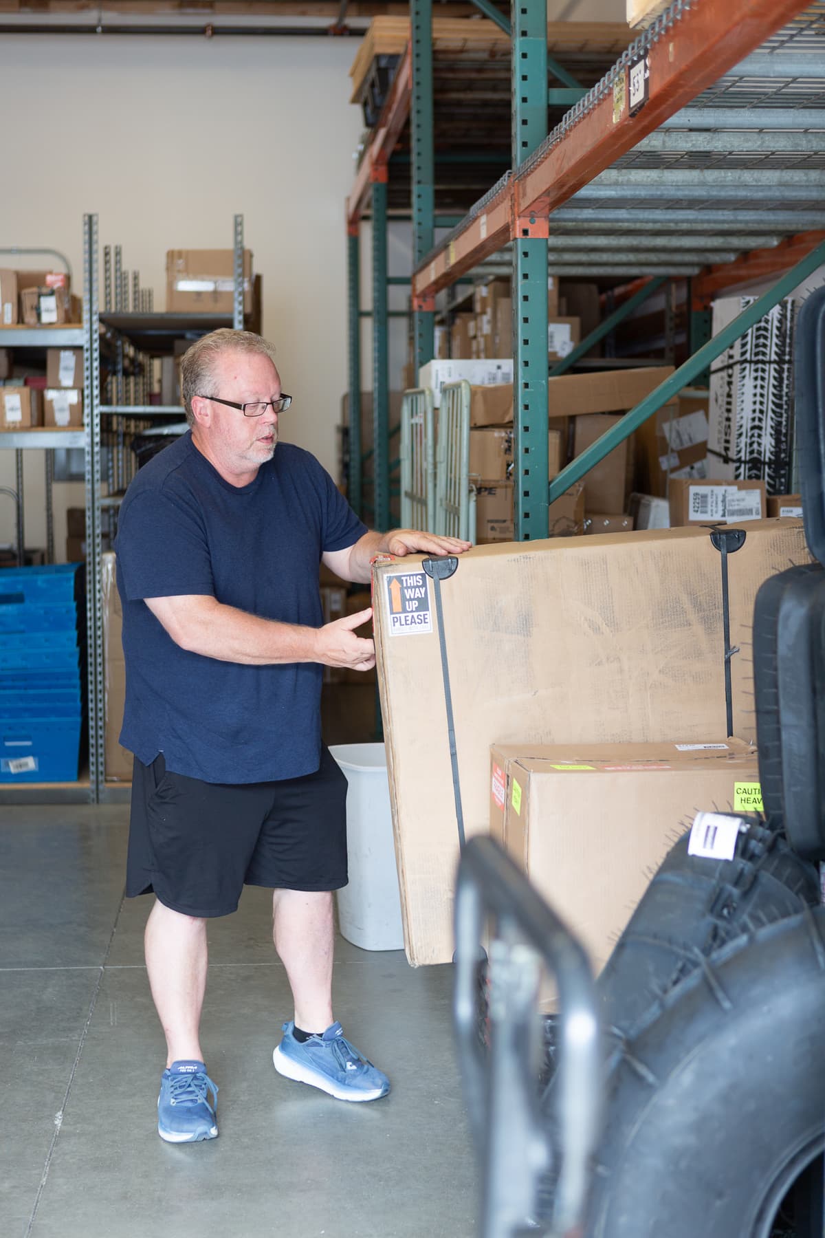 a Hagens employee stacking boxes
